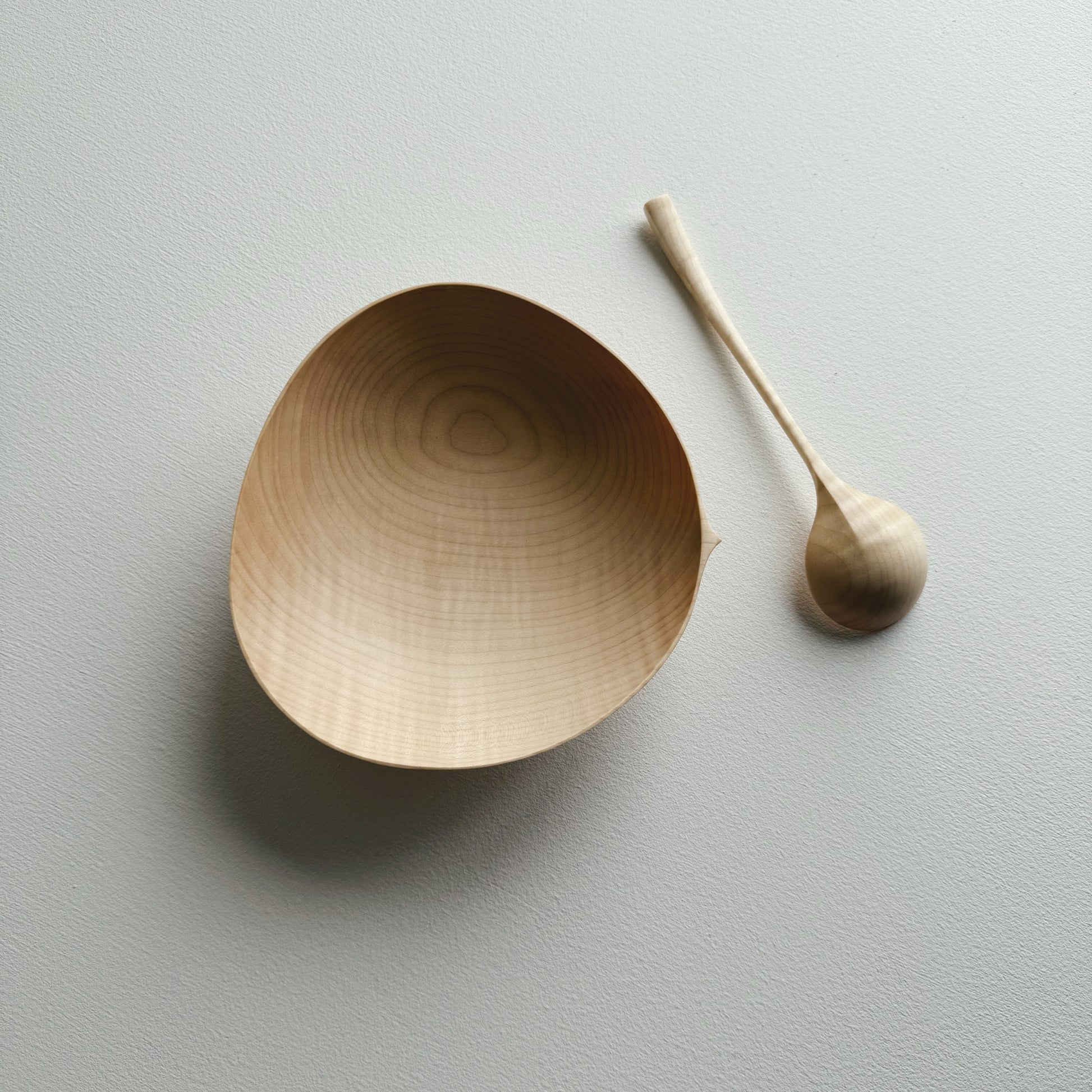 Sycamore bowl and spoon on a white background
