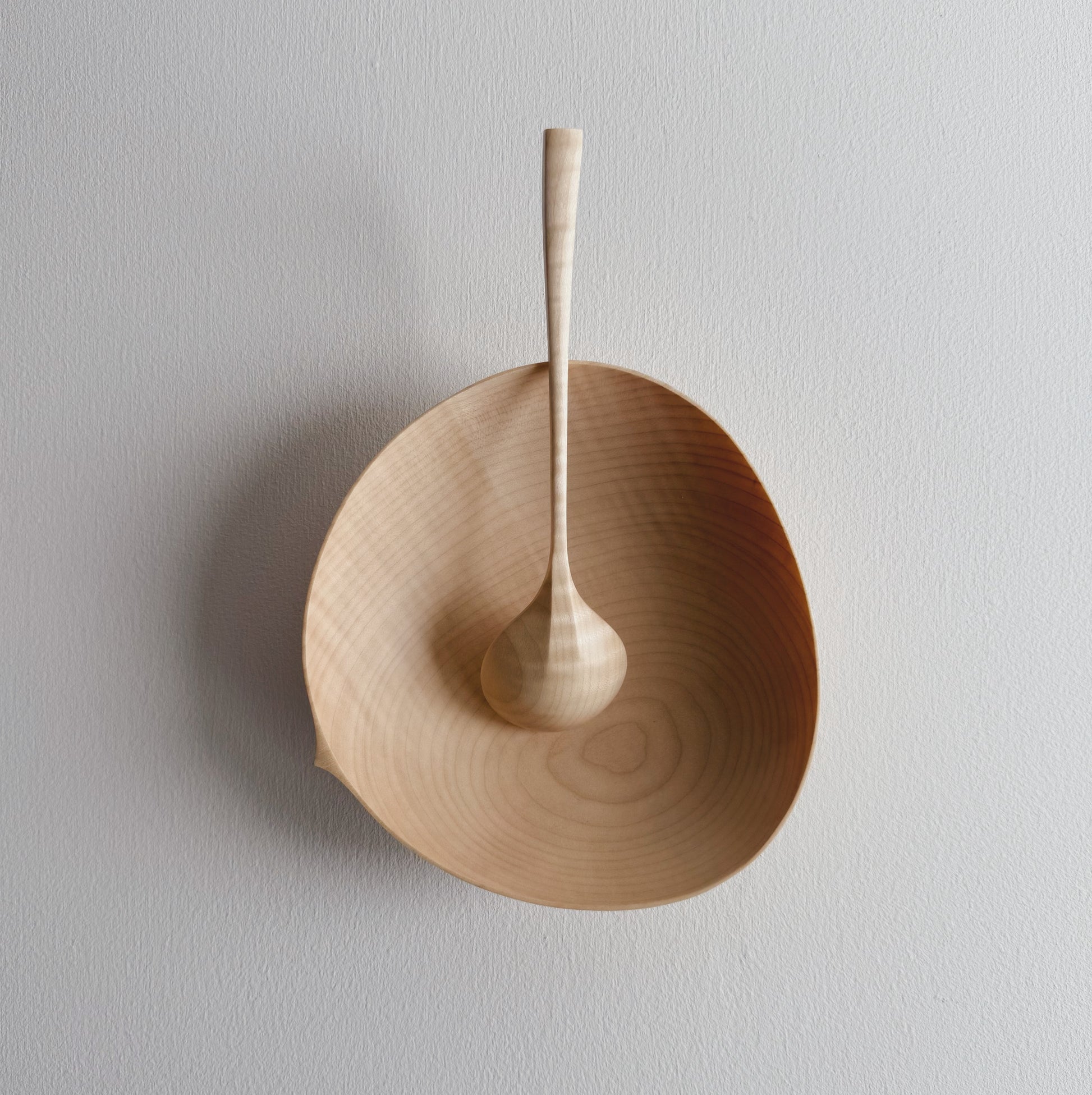 Sycamore bowl and spoon on a white background