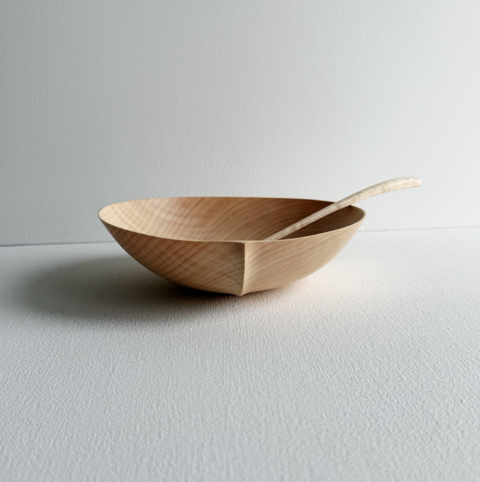 Sycamore bowl and spoon on a white background