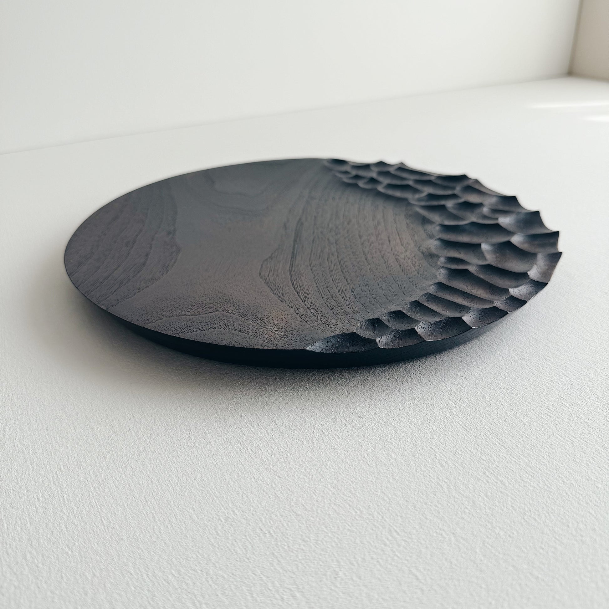 Black walnut presentation plate on a white background 