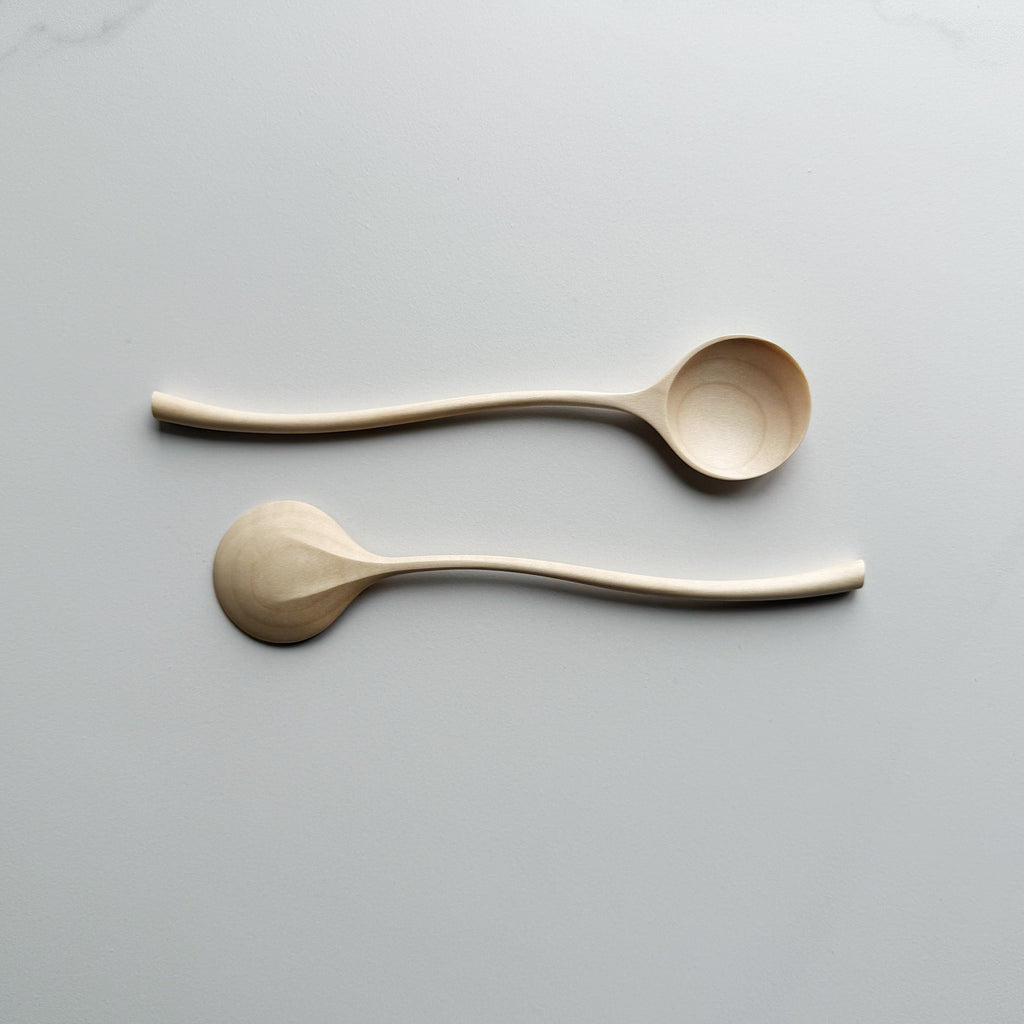 Sycamore curvy spoon on a light background