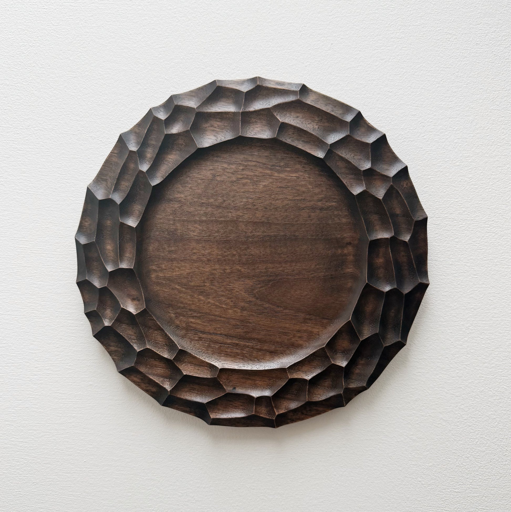 Walnut plate on a white background