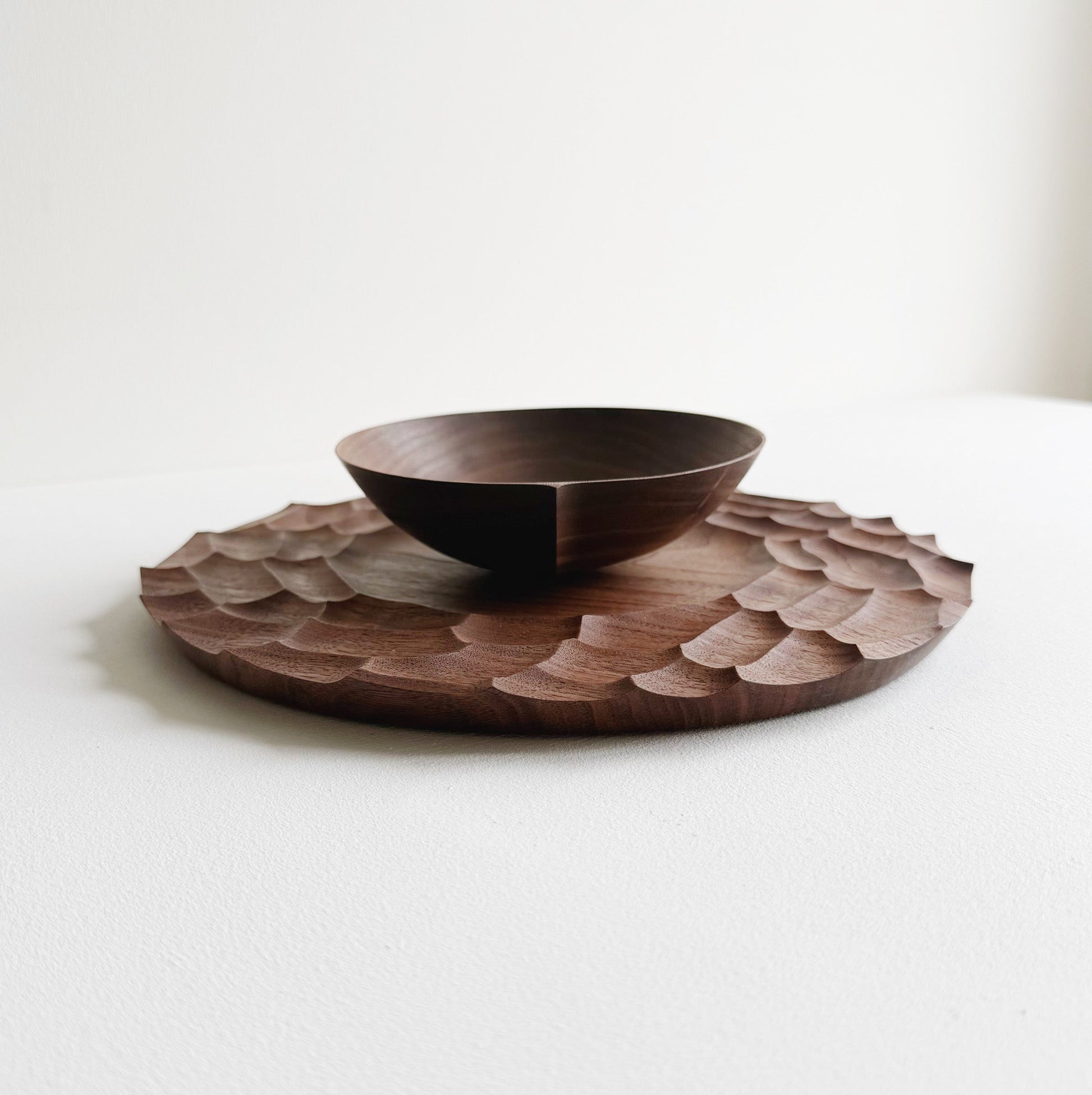Dunes plate and bowl in walnut on a light background