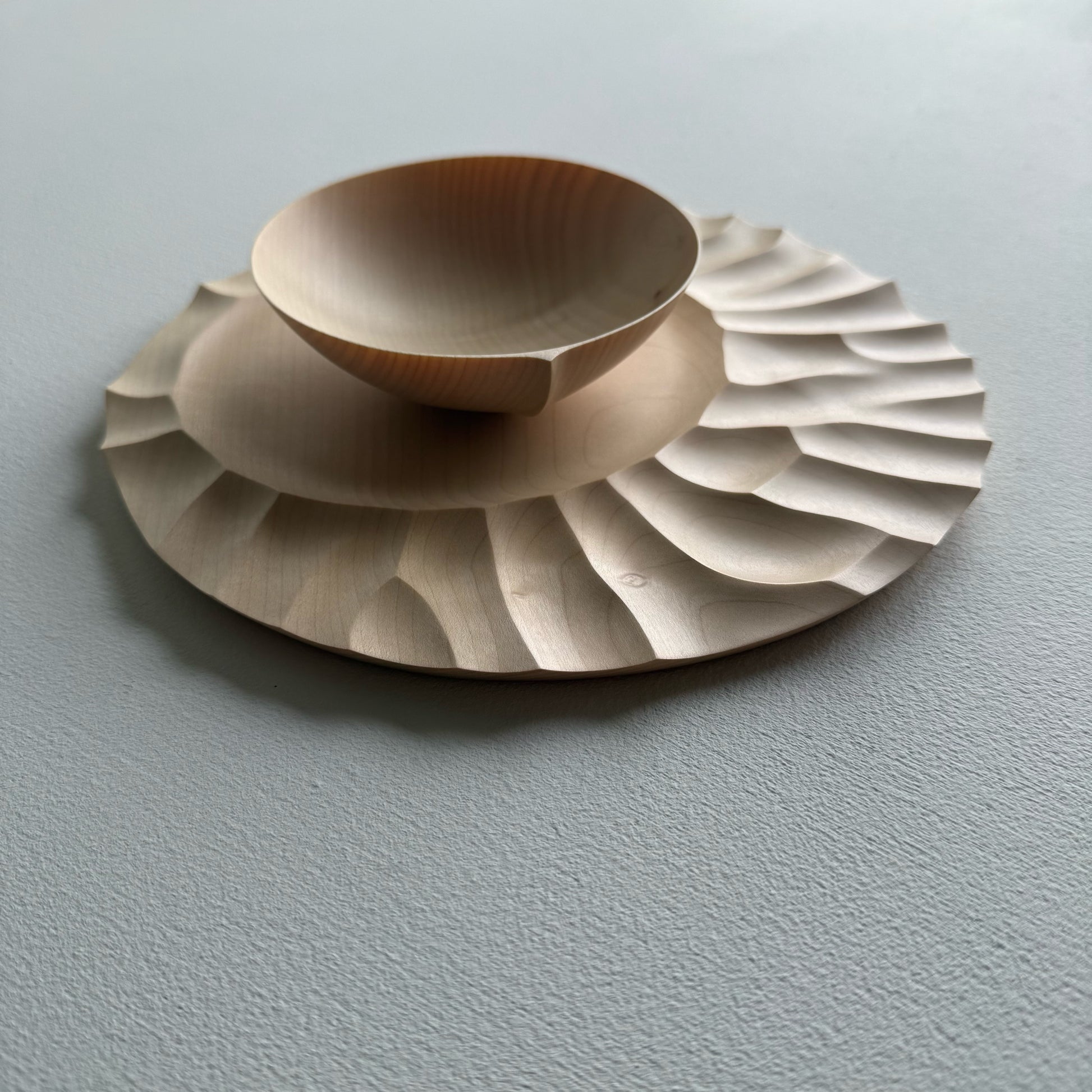 Sycamore wooden bowl with sycamore plate on a white background