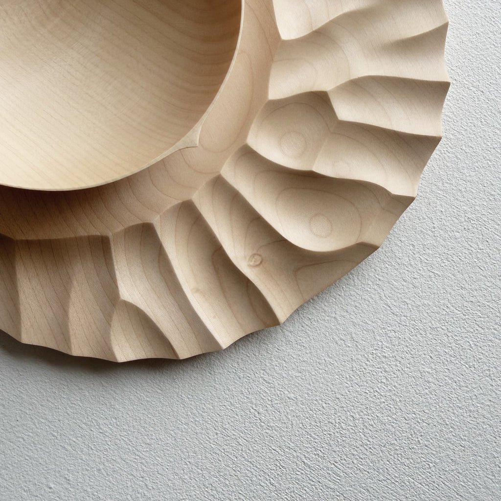 Close up of sycamore wooden bowl with sycamore plate on a white background