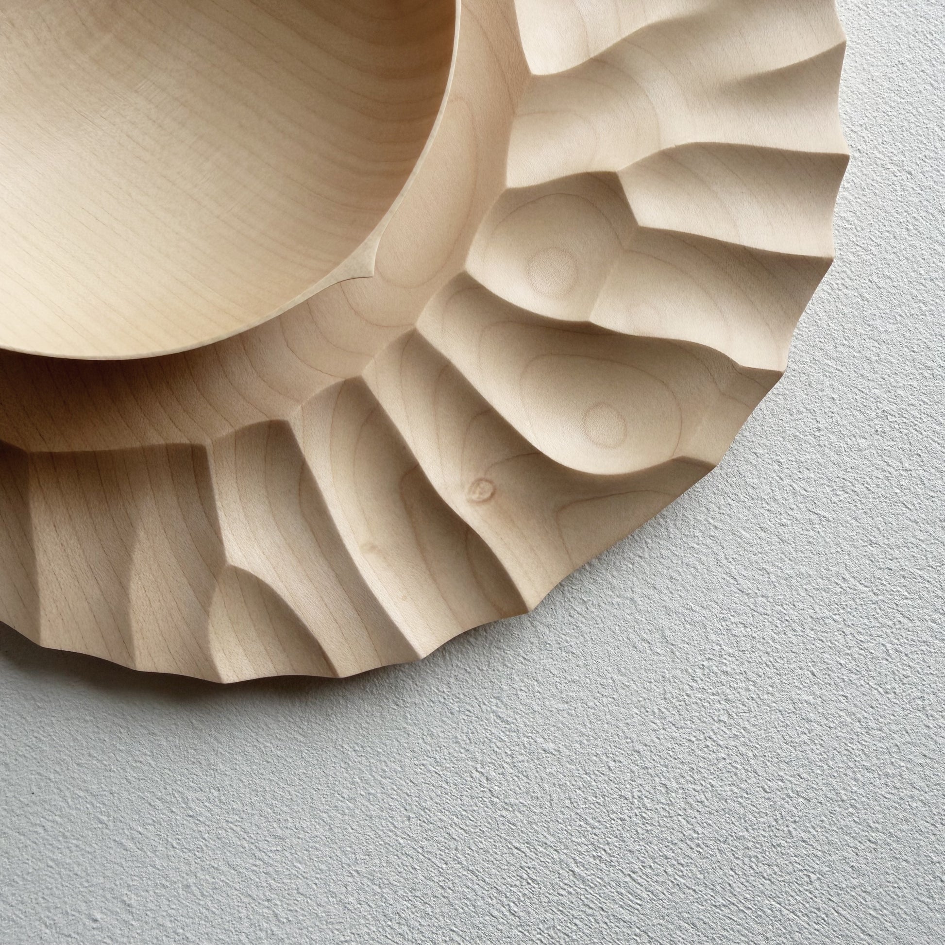 Close up of sycamore wooden bowl with sycamore plate on a white background