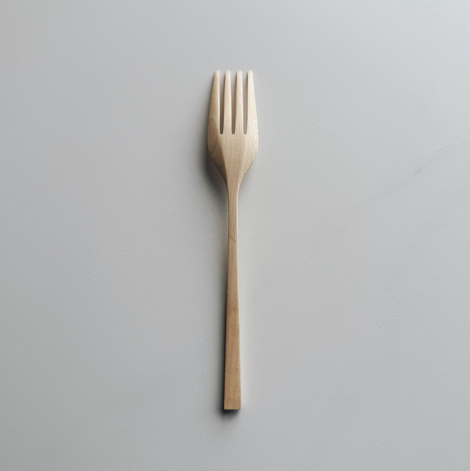 Sycamore fork on light background