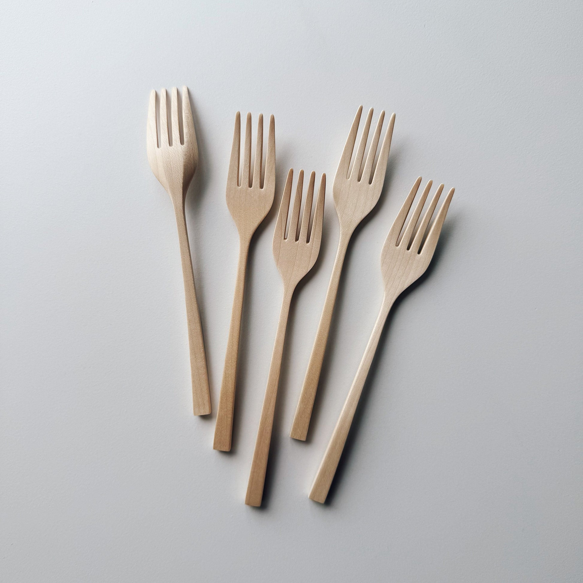 Set of five sycamore forks on light background
