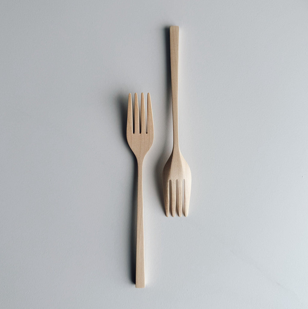 Pair of Sycamore forks on light background