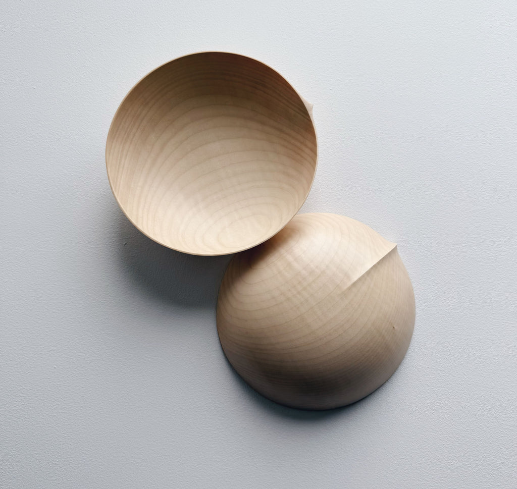 Round palm bowl in sycamore on a white background
