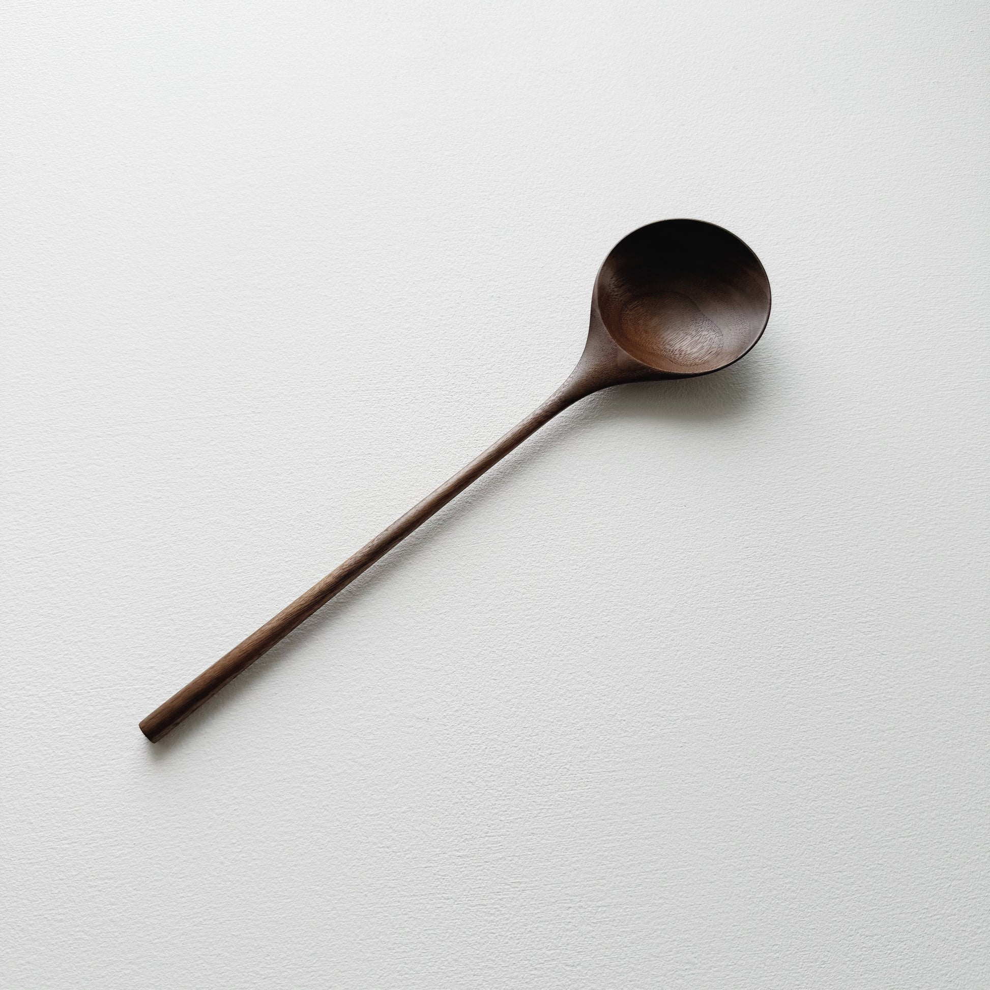 Medium serving spoon in dark walnut