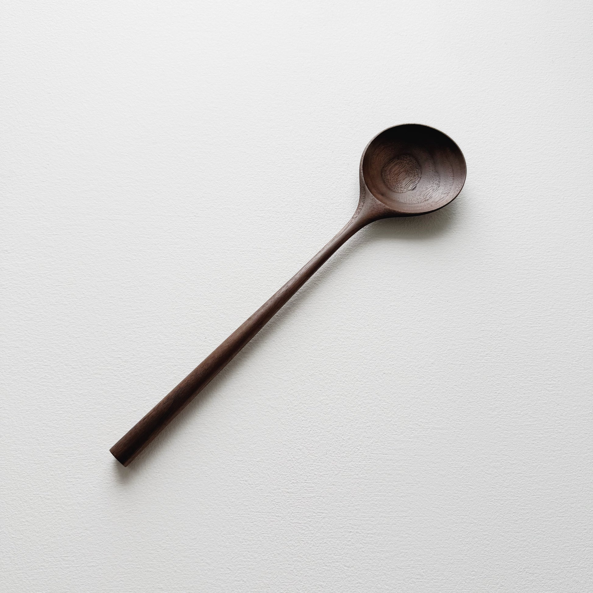 Medium serving spoon in dark walnut