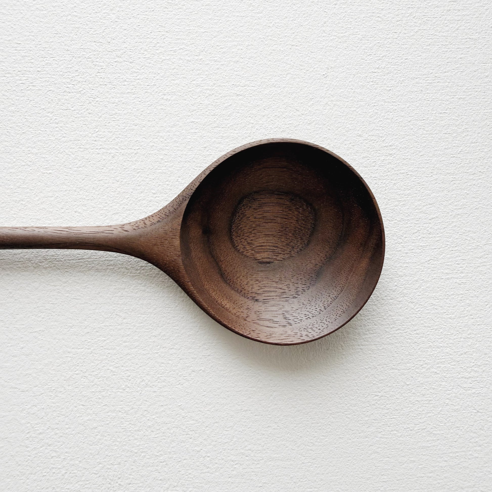 Medium serving spoon in dark walnut