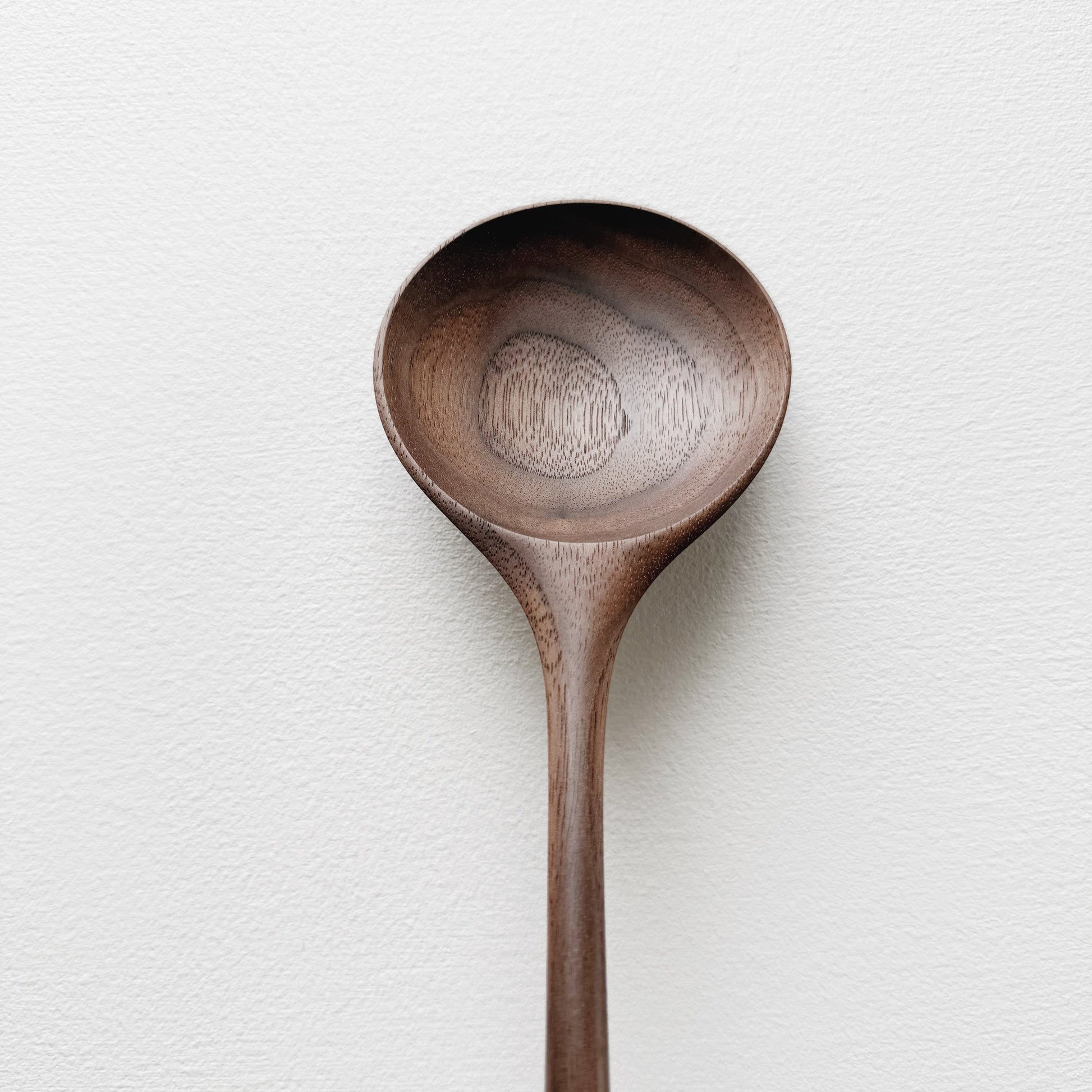 Medium serving spoon in dark walnut