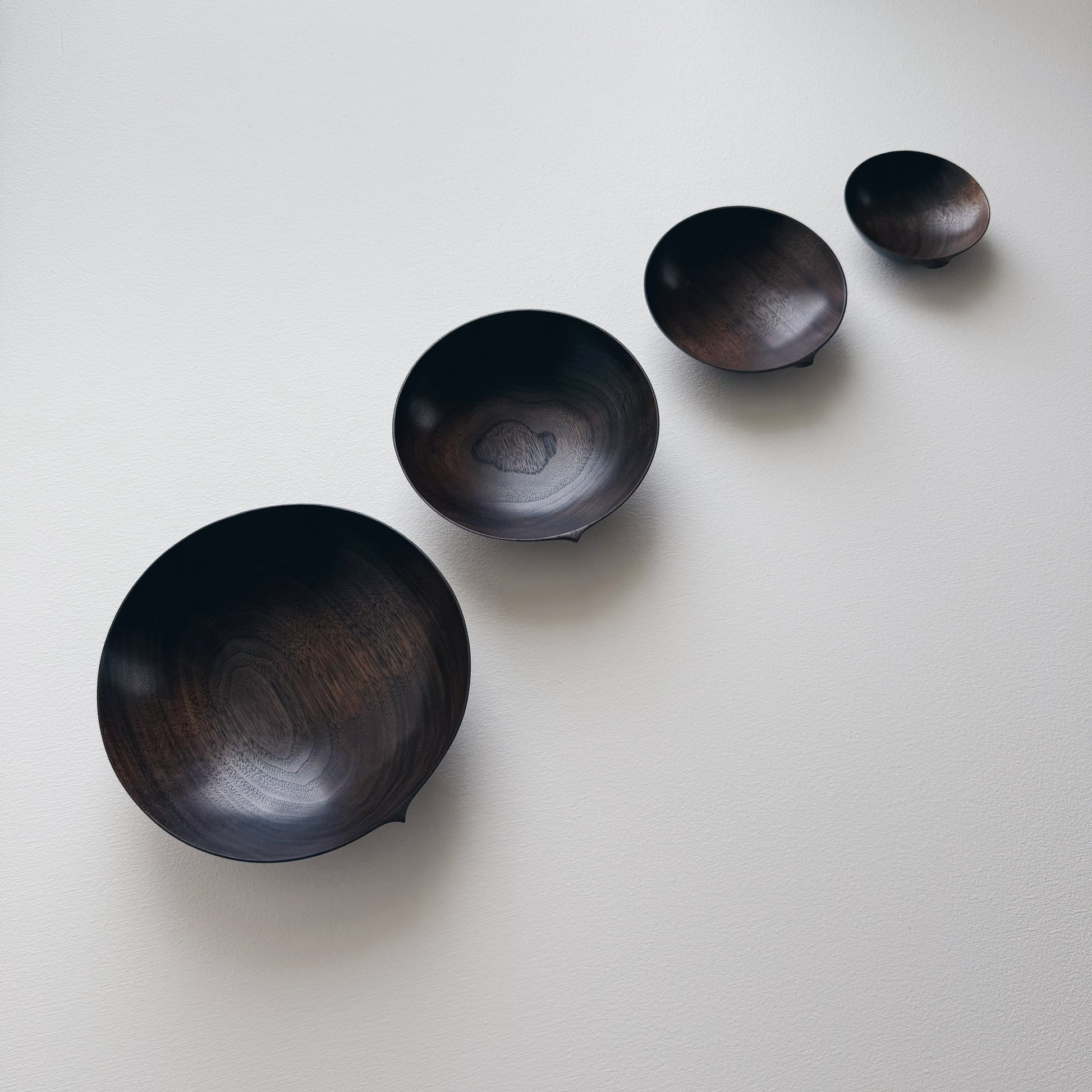 Nesting bowls in vintage black walnut