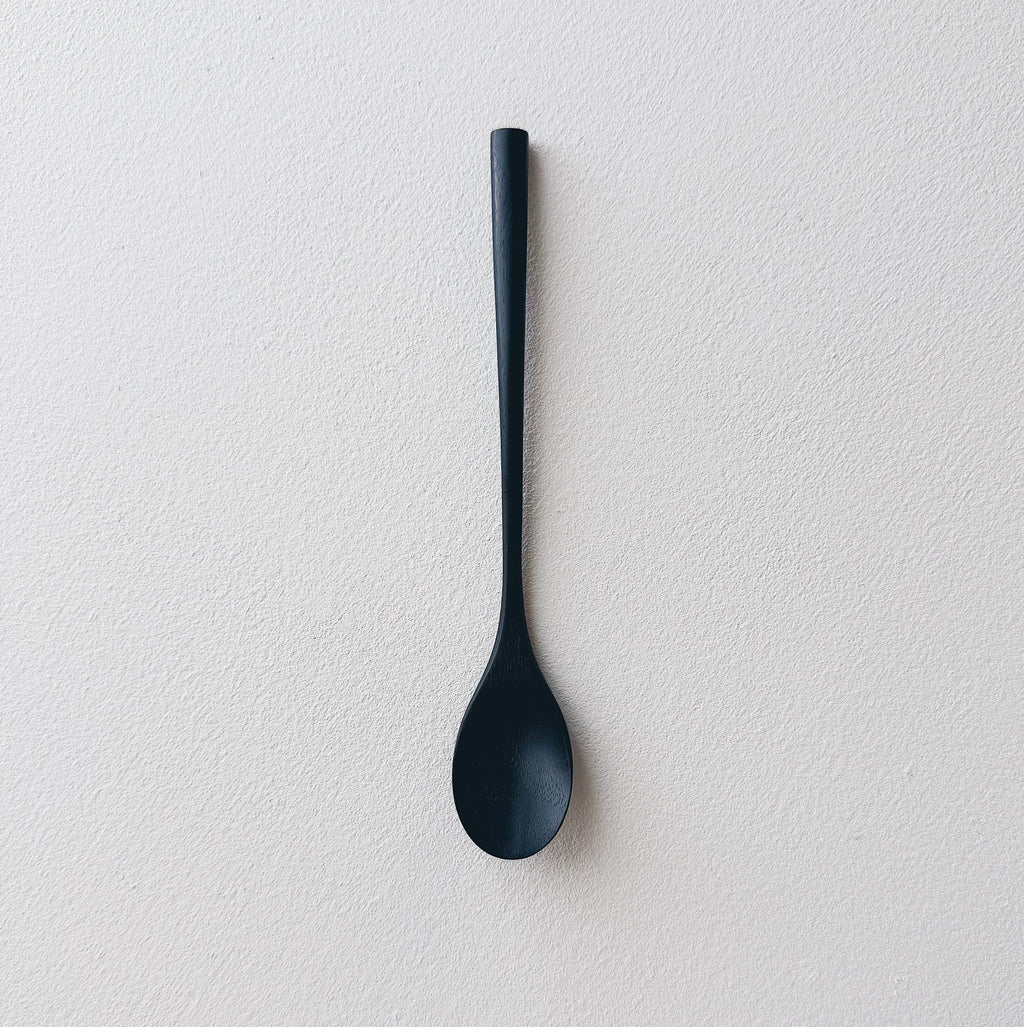 Oval eating spoon in ebonised walnut