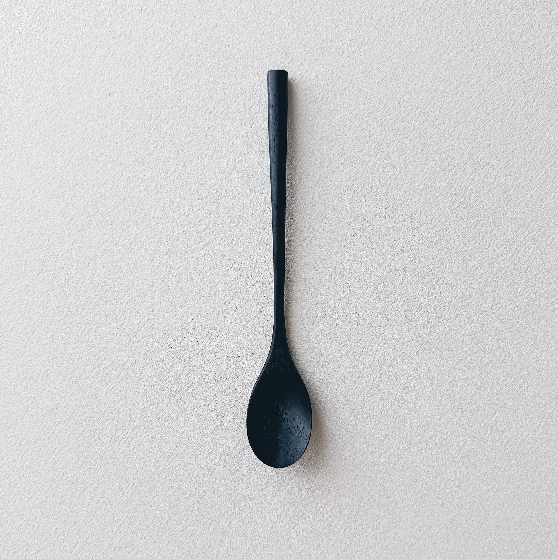 Oval eating spoon in ebonised walnut