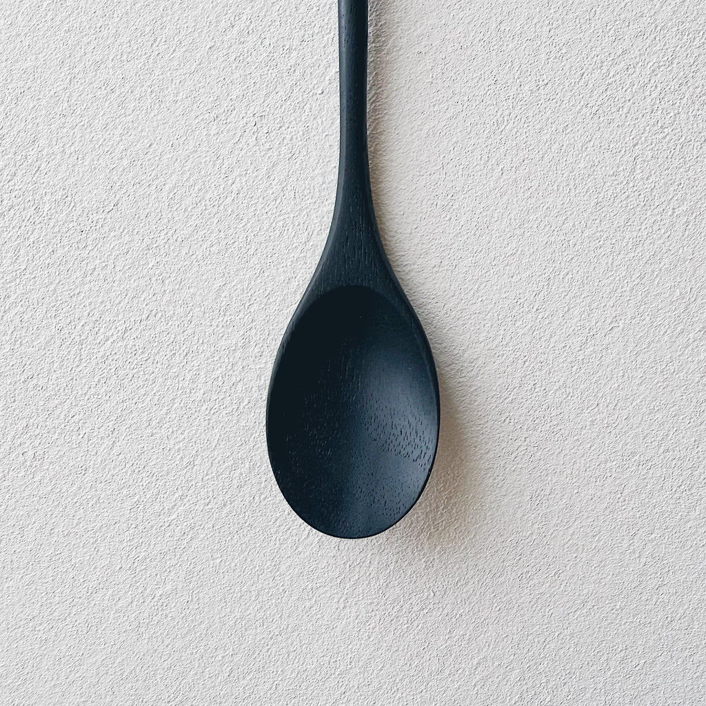 Oval eating spoon in ebonised walnut