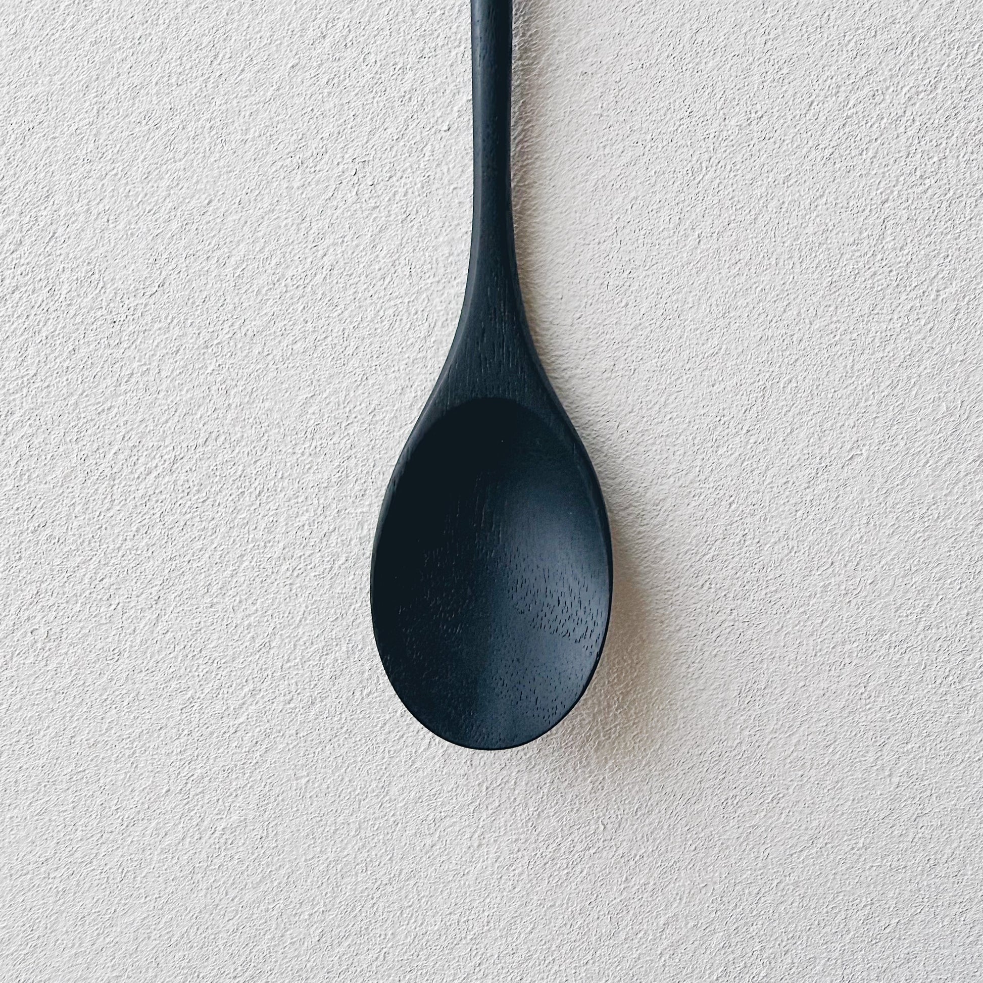 Oval eating spoon in ebonised walnut