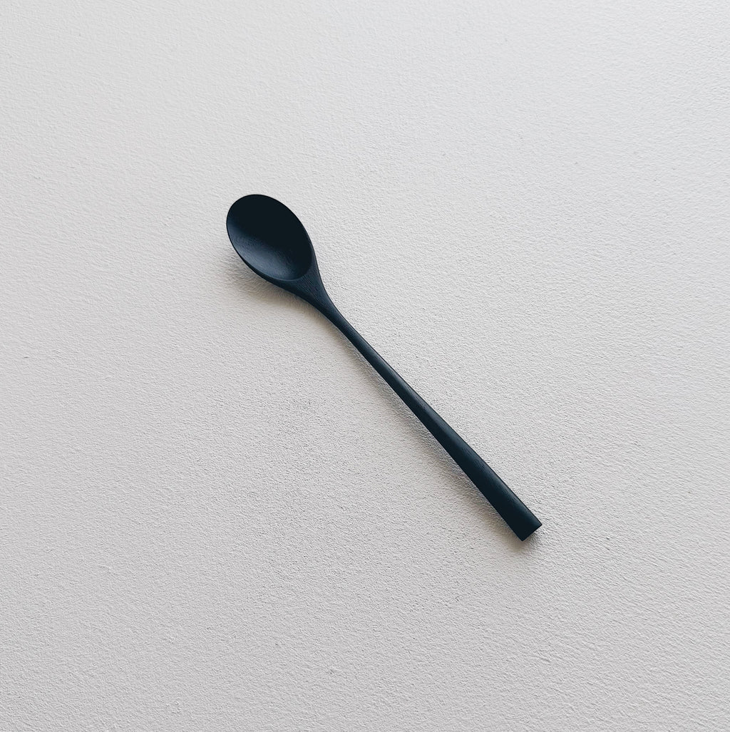 Oval eating spoon in ebonised walnut