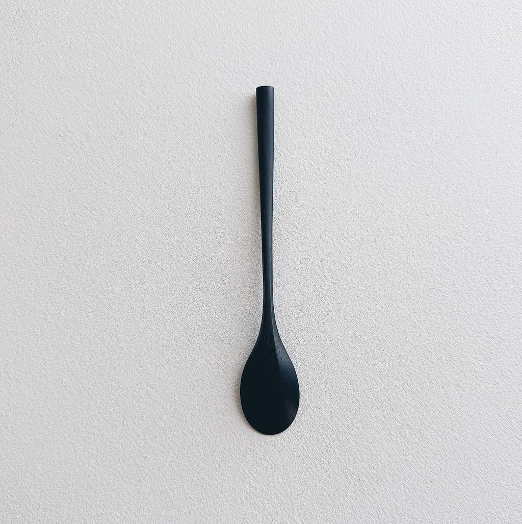 Oval eating spoon in ebonised walnut