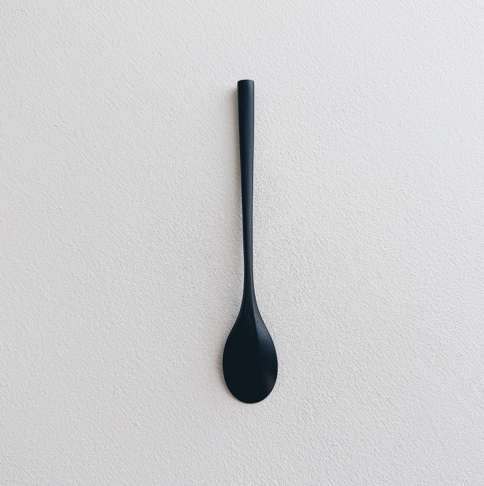 Oval eating spoon in ebonised walnut
