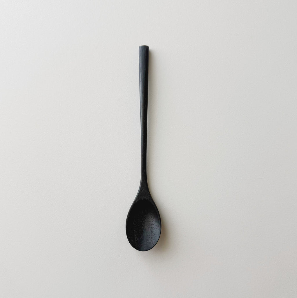 Oval eating spoon in ebonised walnut