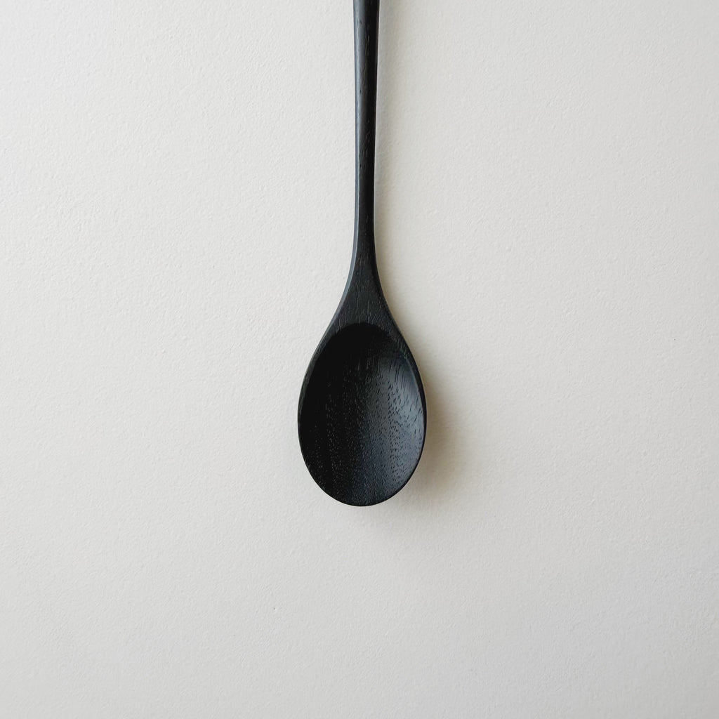 Oval eating spoon in ebonised walnut