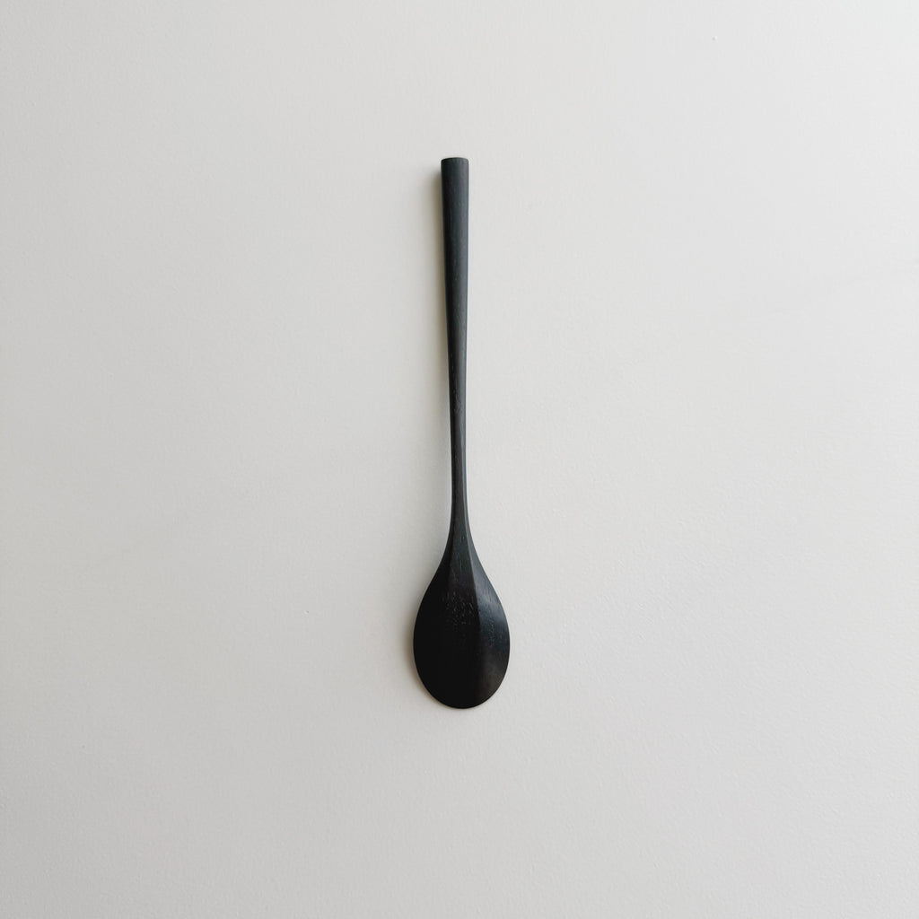Oval eating spoon in ebonised walnut