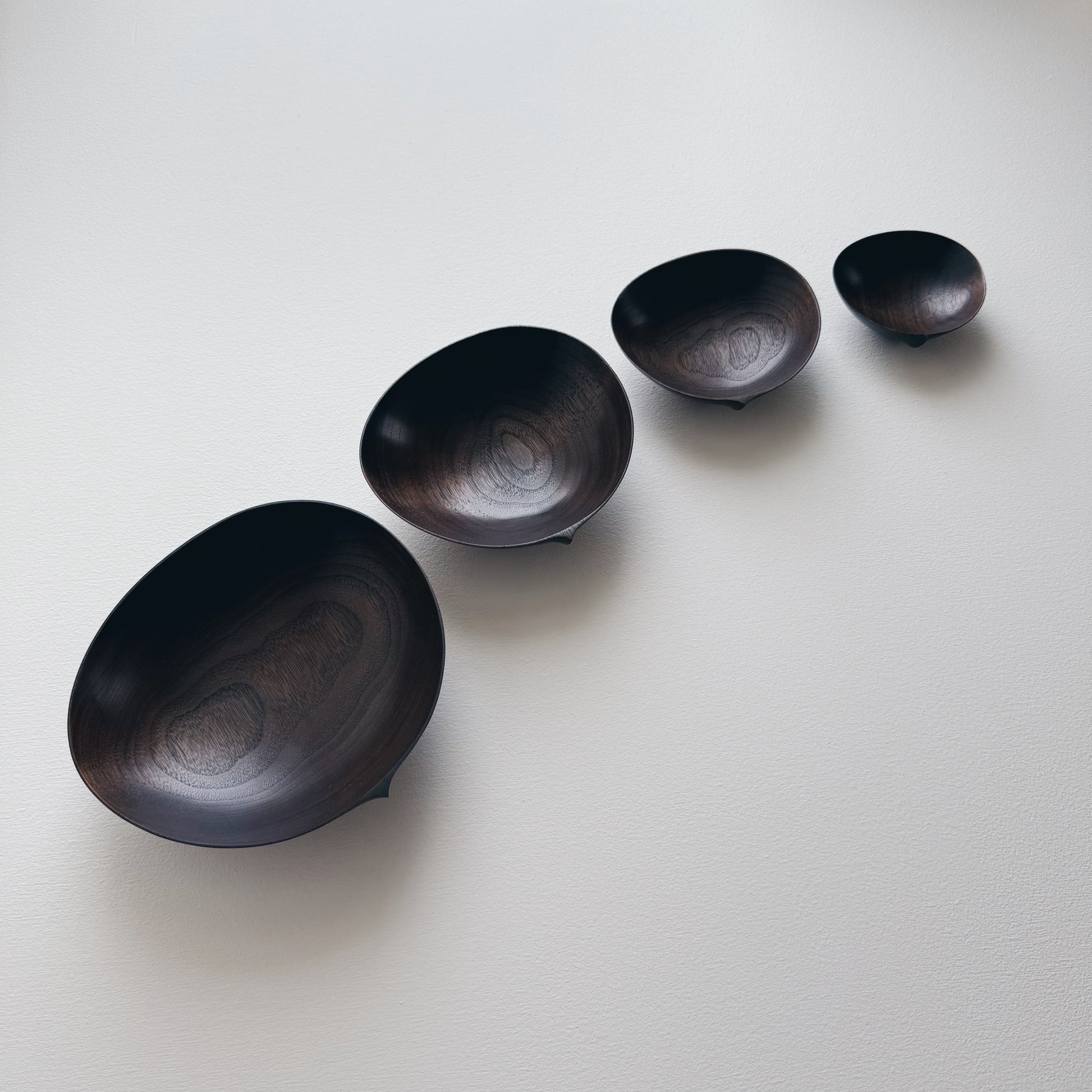 Oval nesting bowls in vintage black walnut