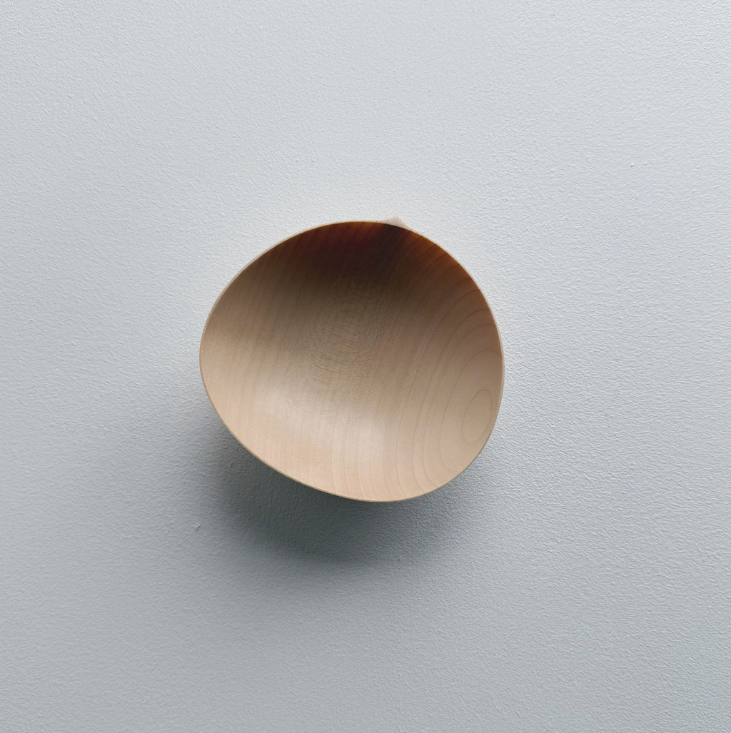 Oval palm bowl in sycamore on a white background