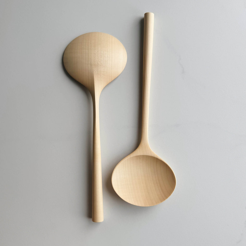 Two large oval servers on a white background