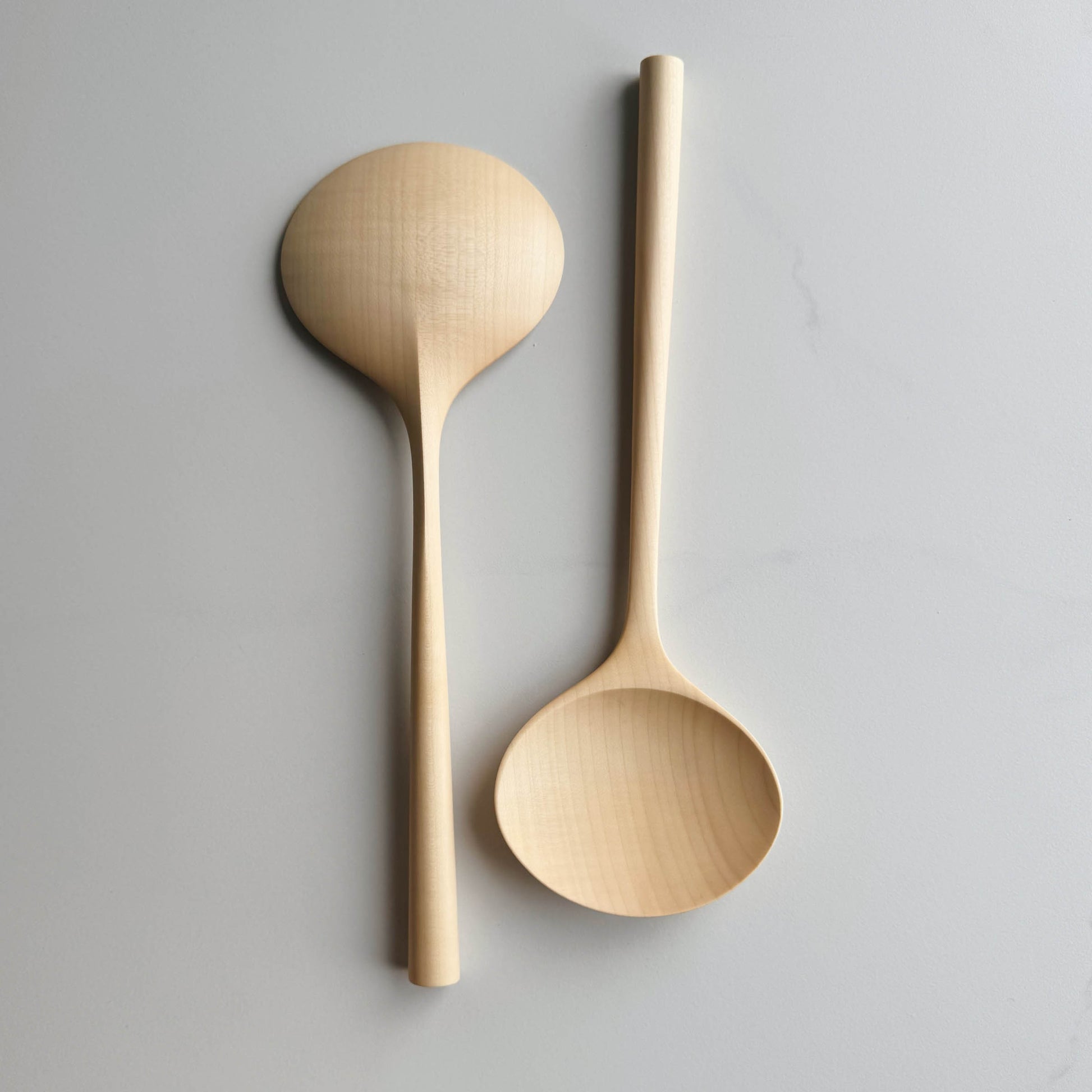 Two large oval servers on a white background