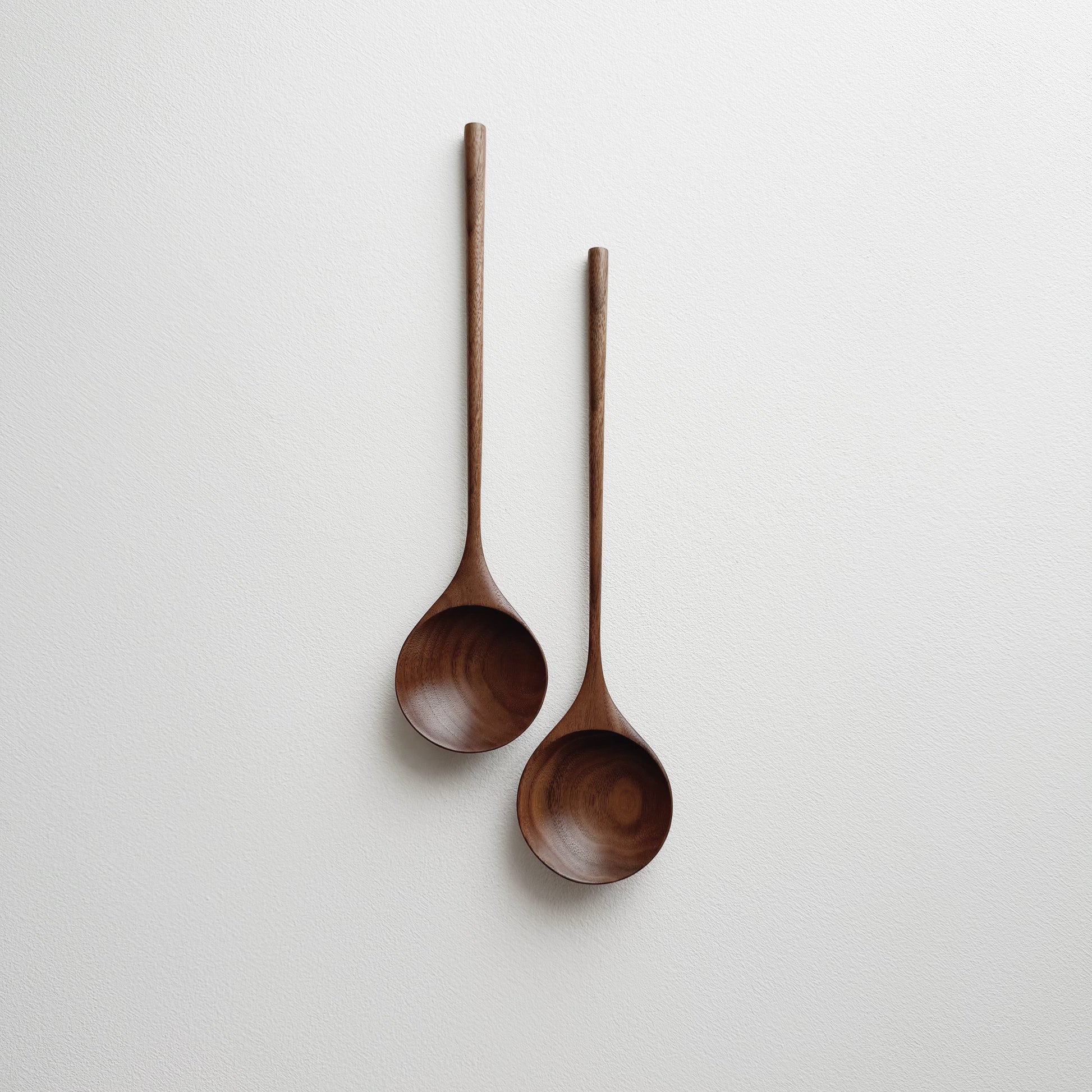 Pair of medium serving spoons in walnut