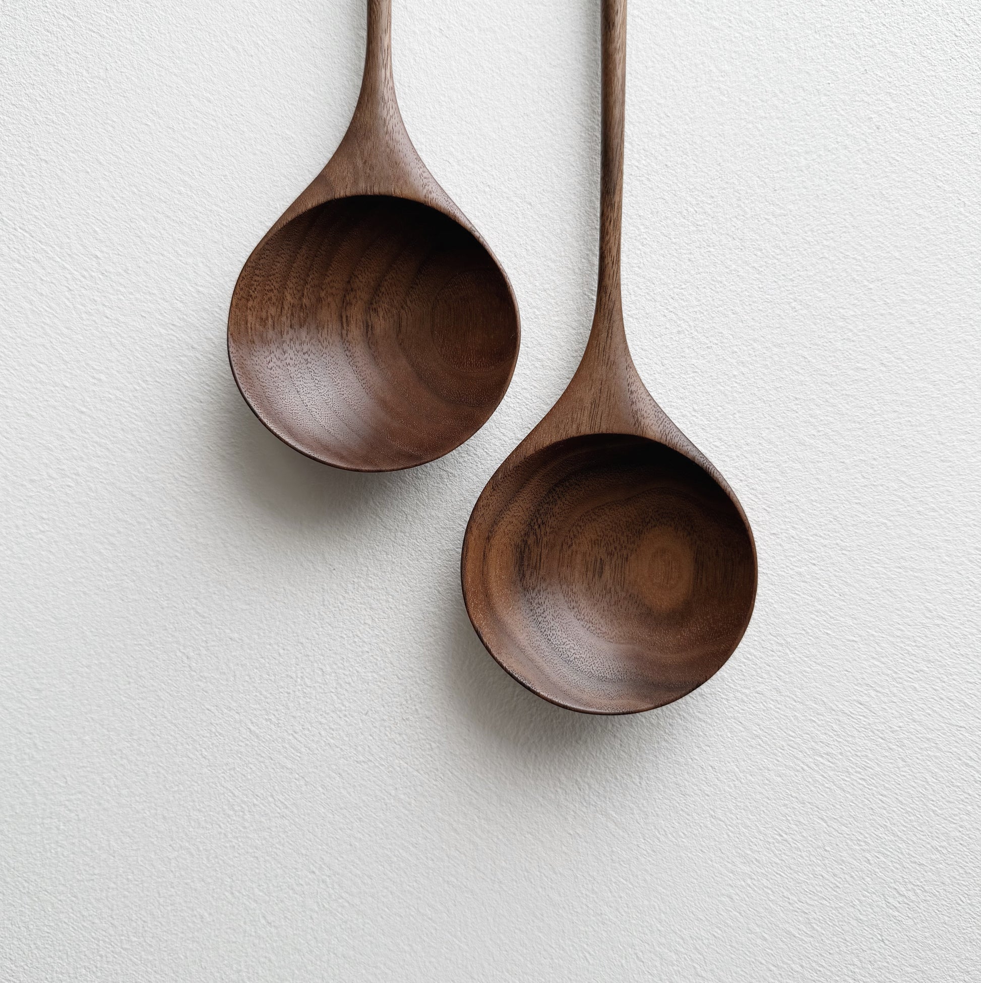 Pair of medium serving spoons in walnut