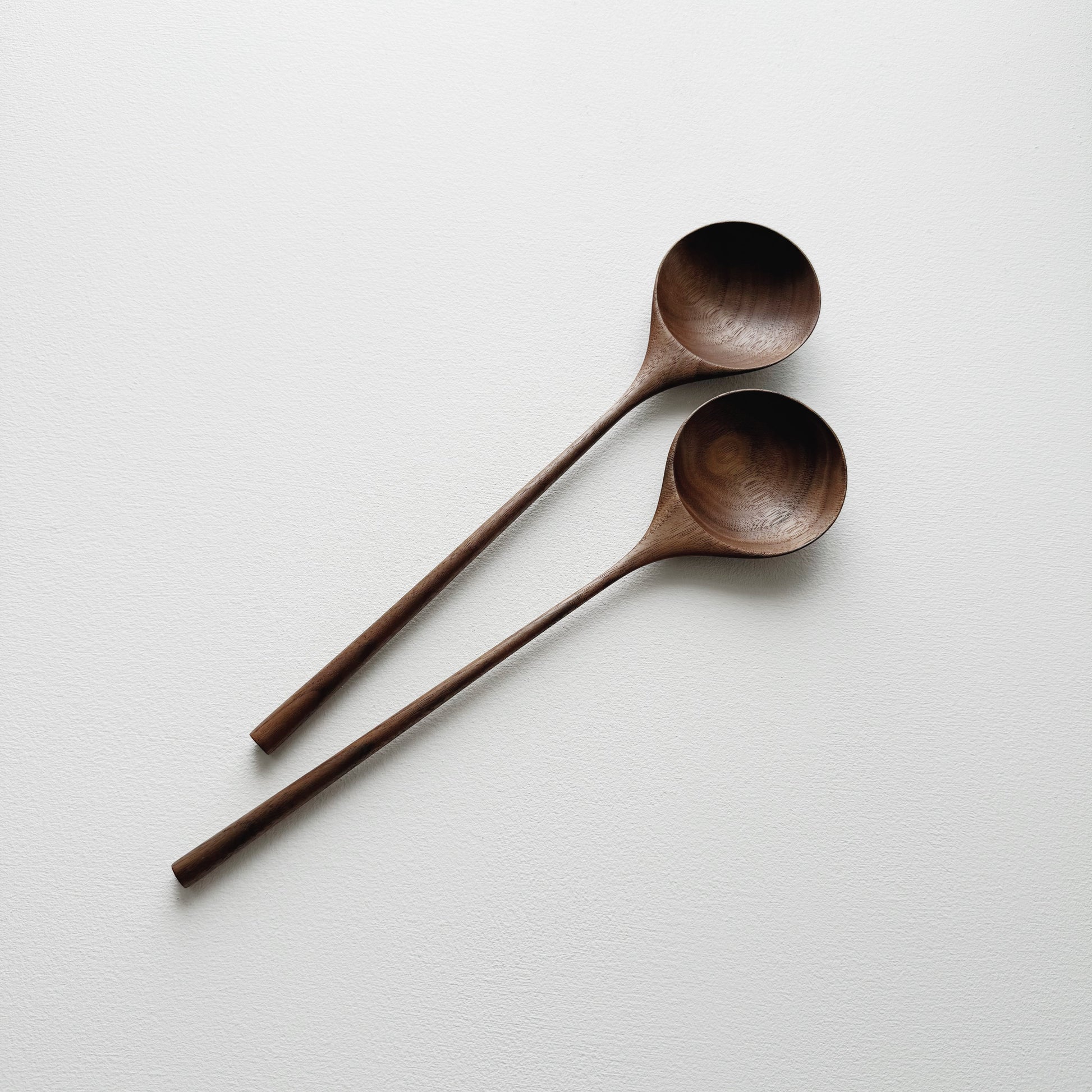 Pair of medium serving spoons in walnut