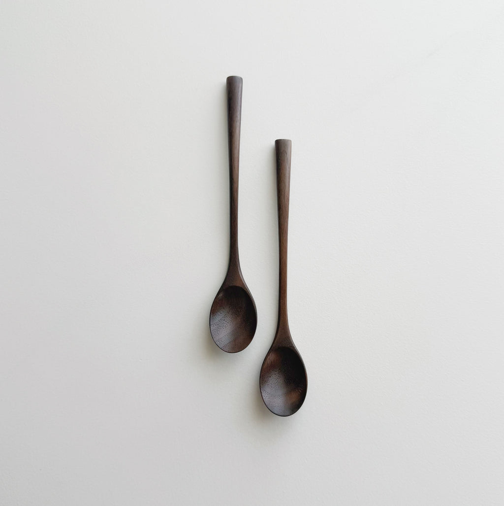 Pair of small oval eating spoons in walnut
