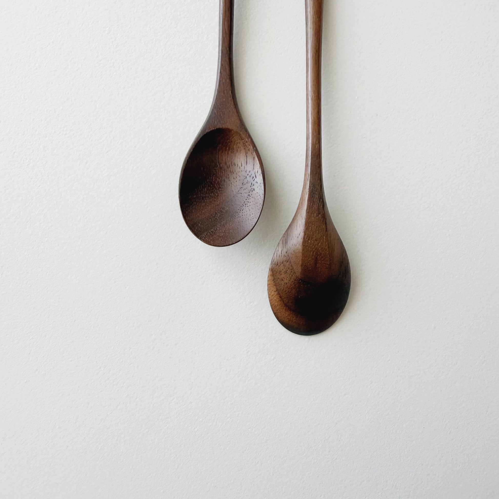Pair of small oval eating spoons in walnut