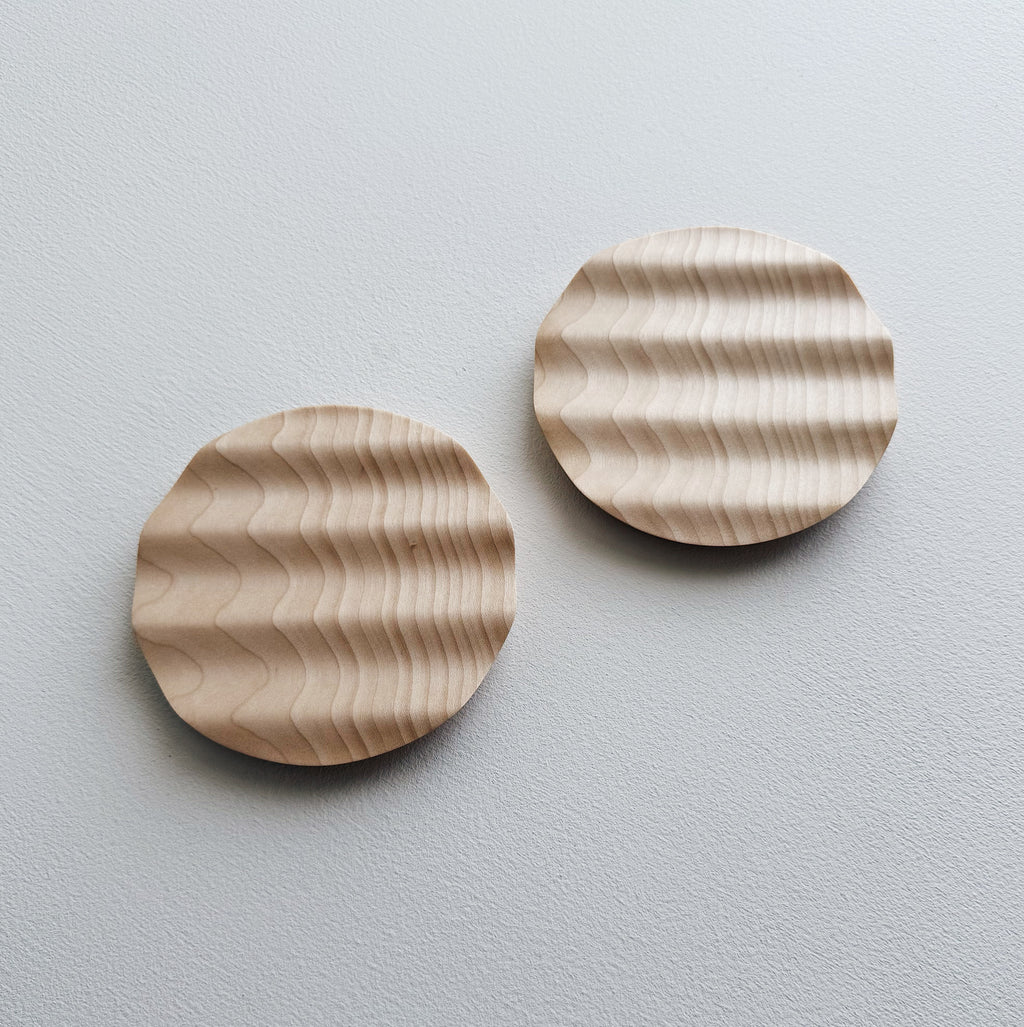 Pair of small wavy side plates in sycamore