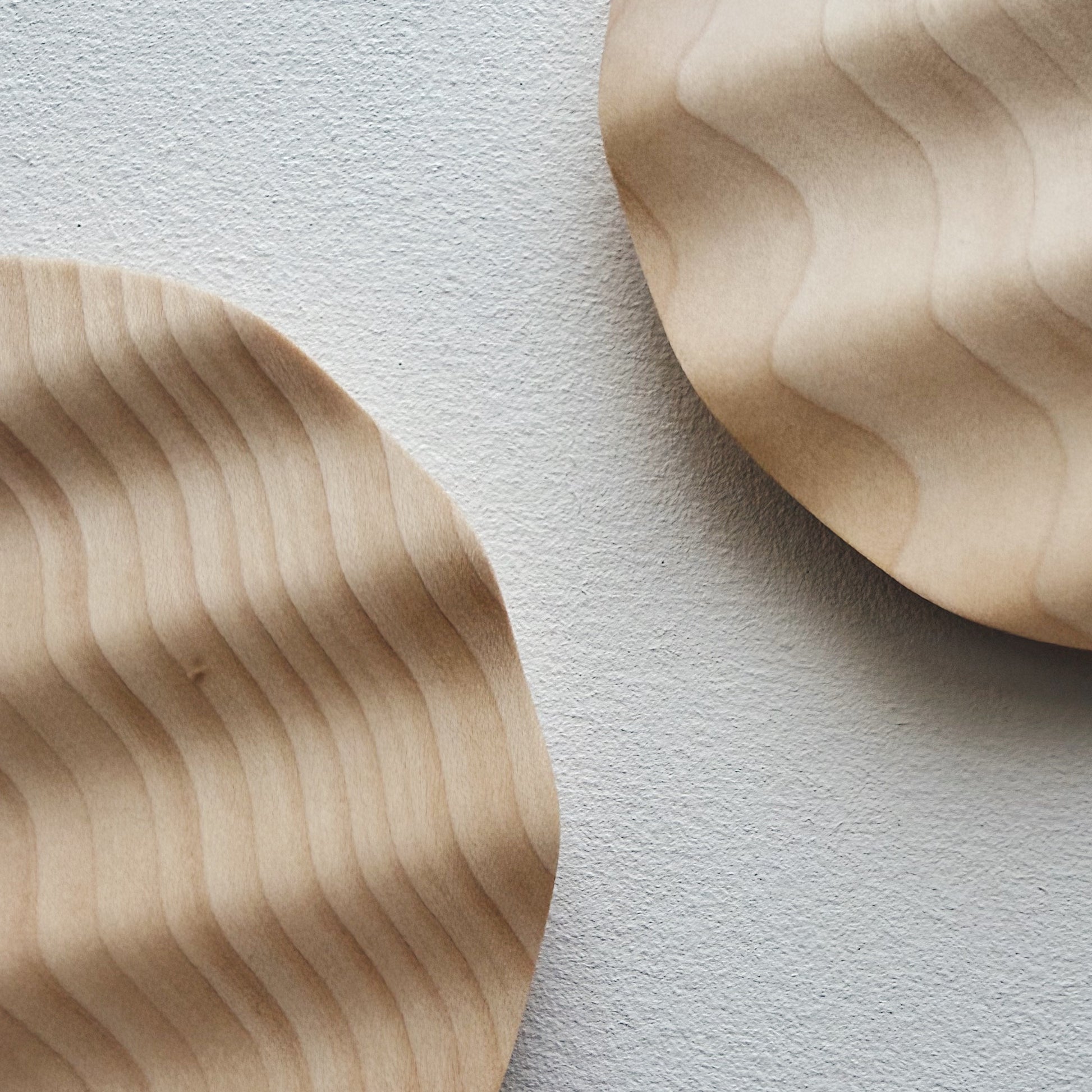 Pair of small wavy side plates in sycamore