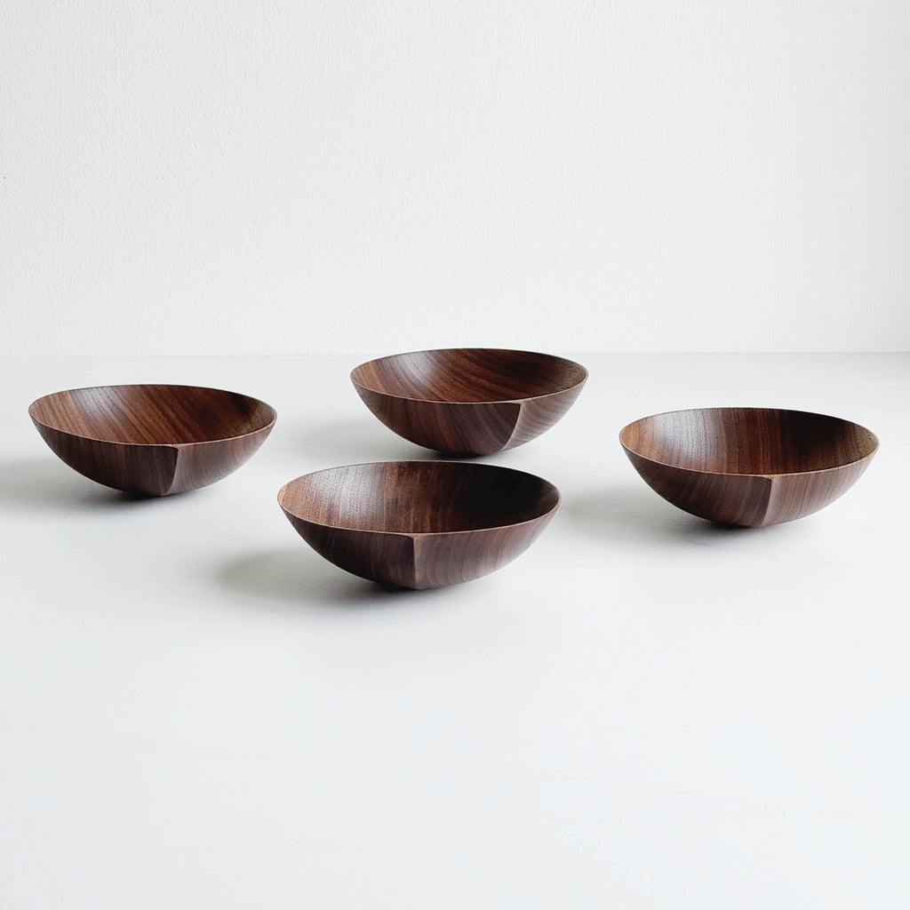 Wooden bowls in walnut on a white background
