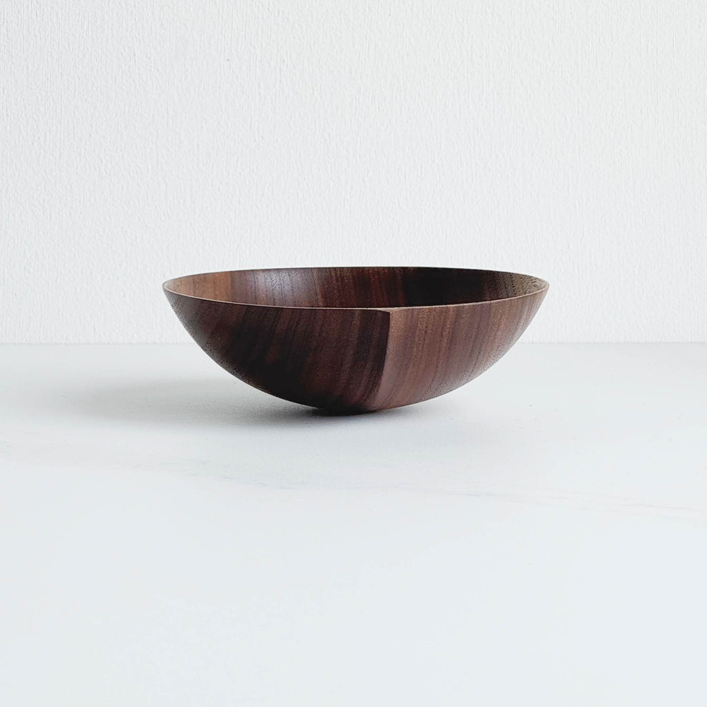 Walnut wooden bowl on a white background