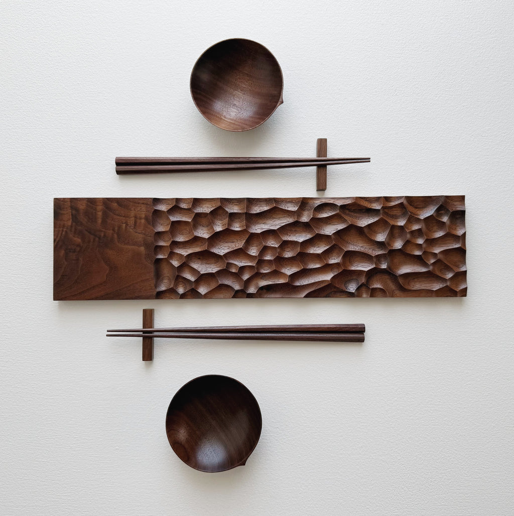 Sculpted long board eating set in walnut