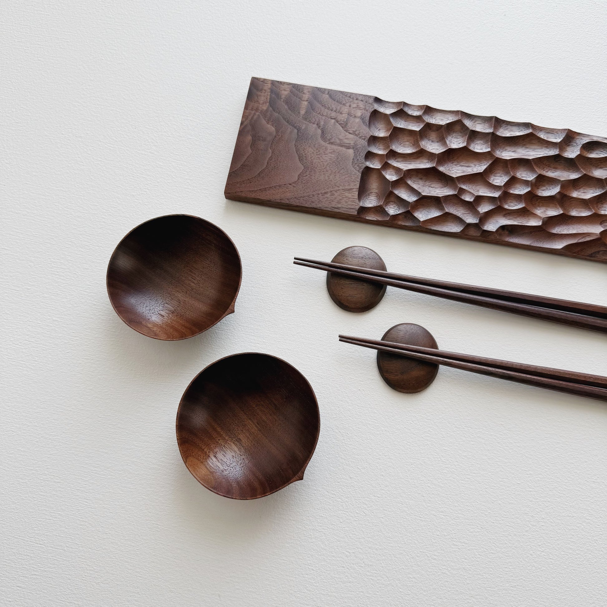 Sculpted long board eating set in walnut