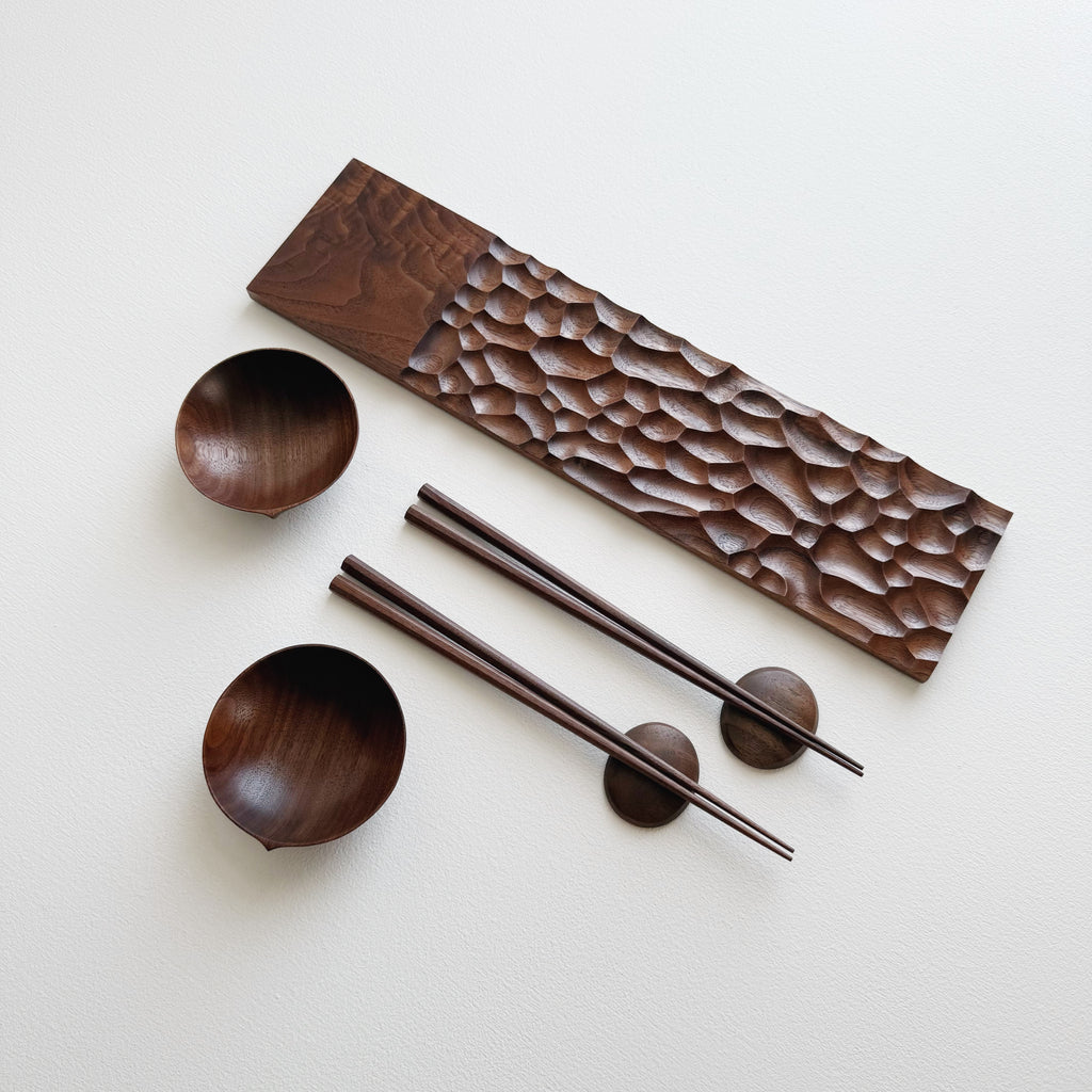 Sculpted long board eating set in walnut
