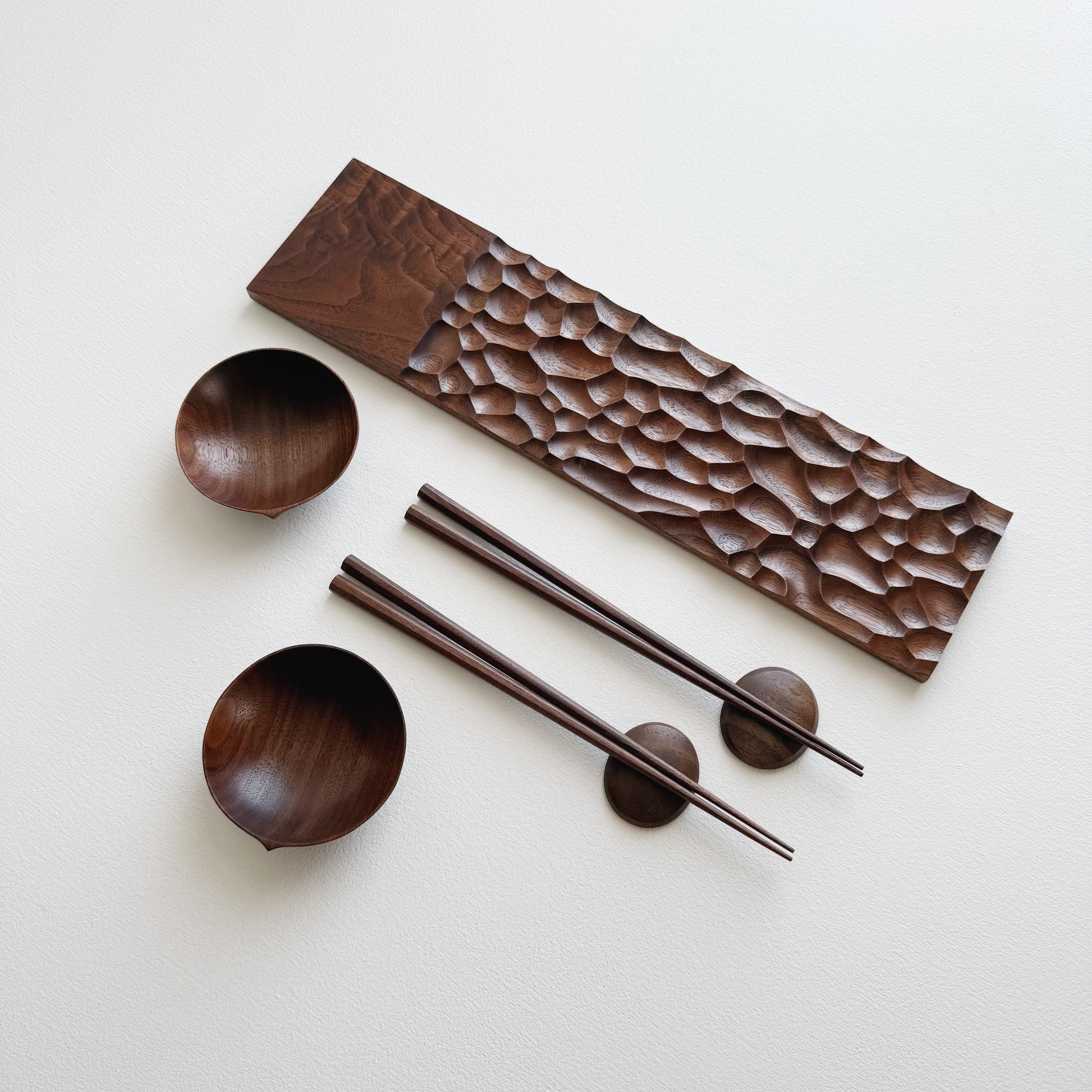 Sculpted long board eating set in walnut