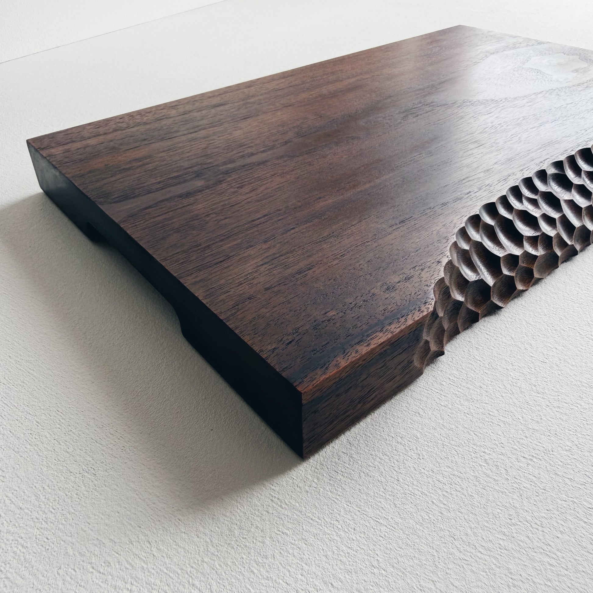 Black walnut board with crater edge on a white background