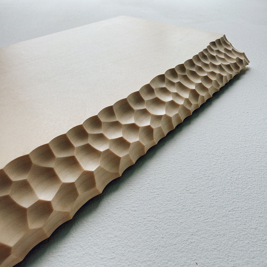 Close up of sycamore wooden presentation board with crater edge on a white background