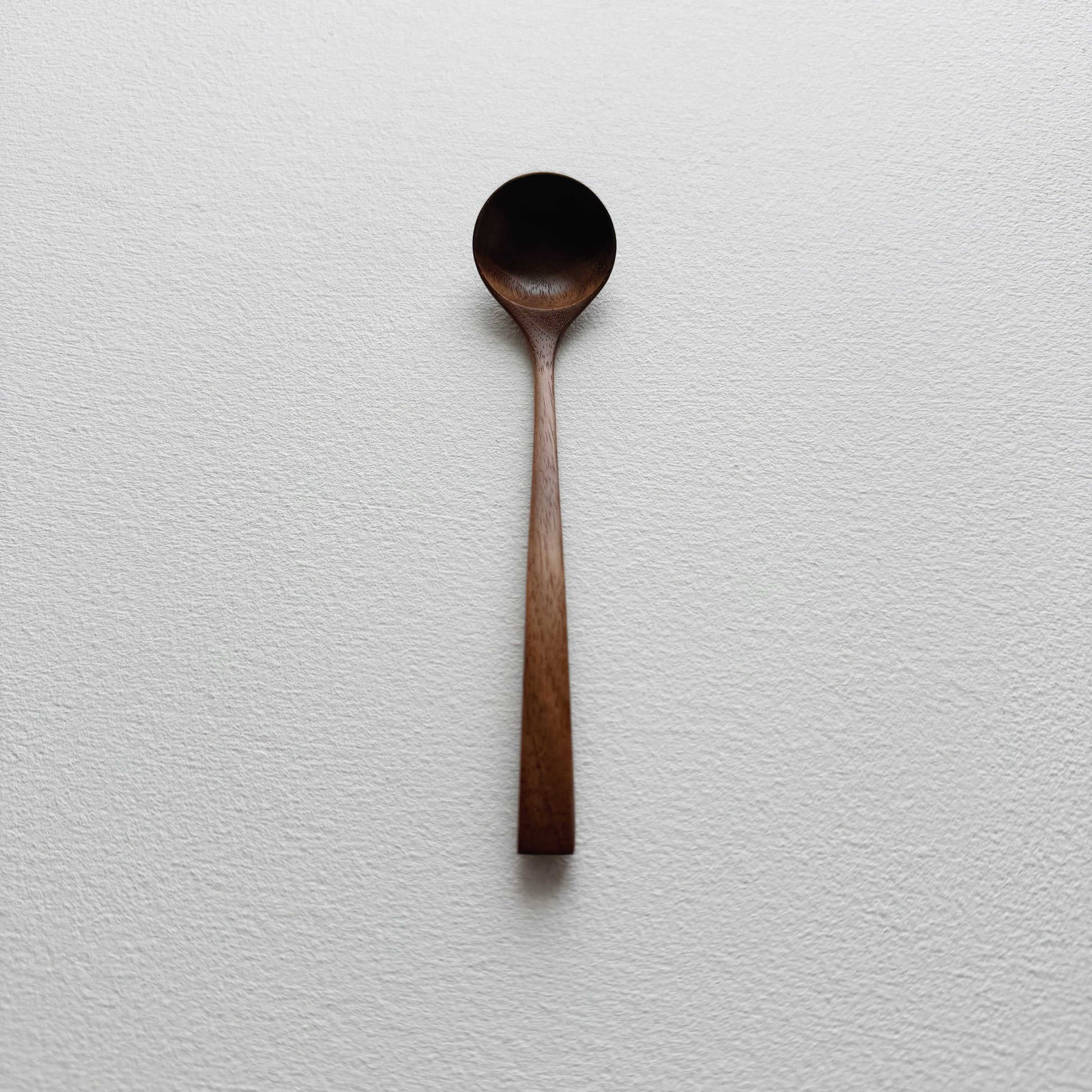 Small angled spoon in walnut