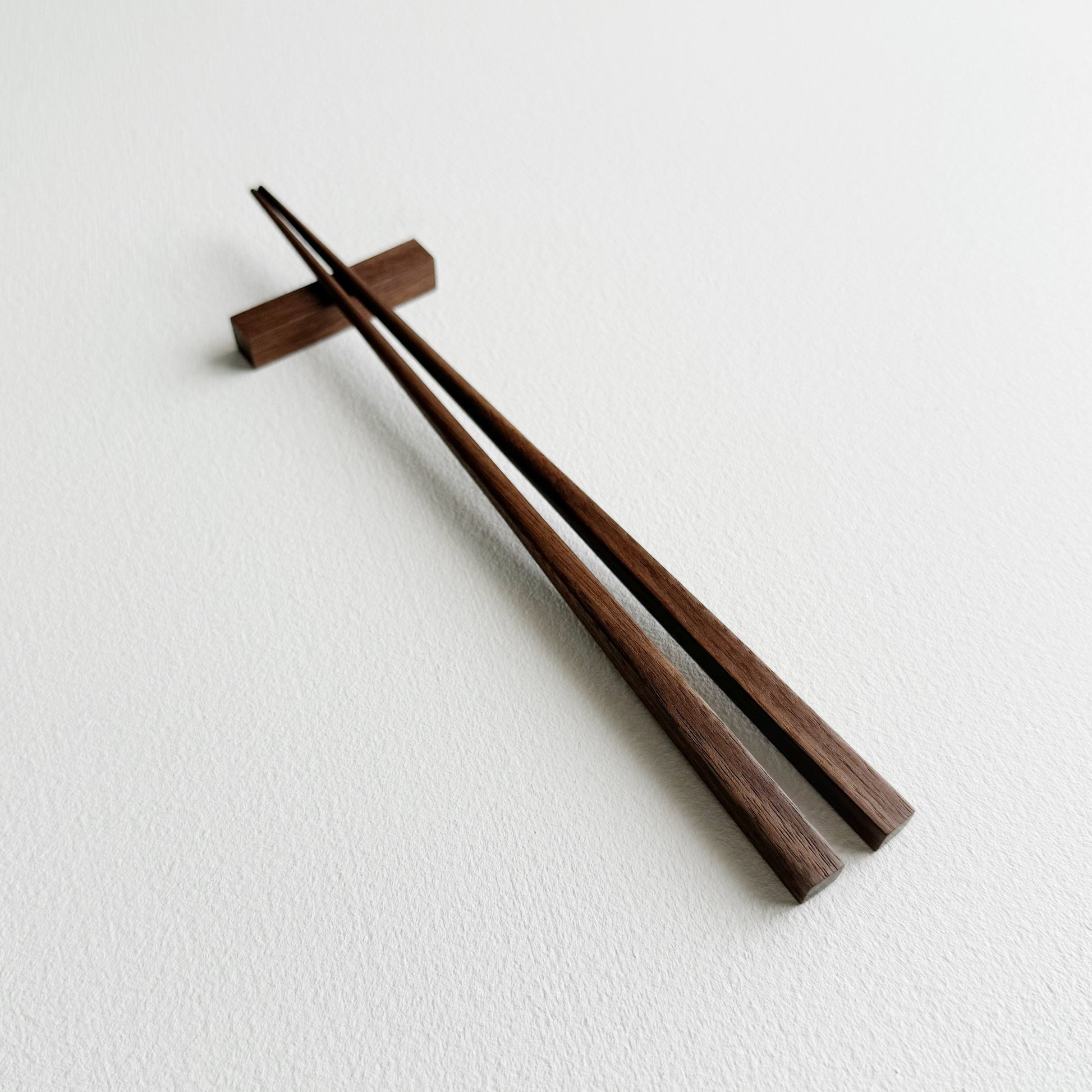 Small squared chopsticks in walnut